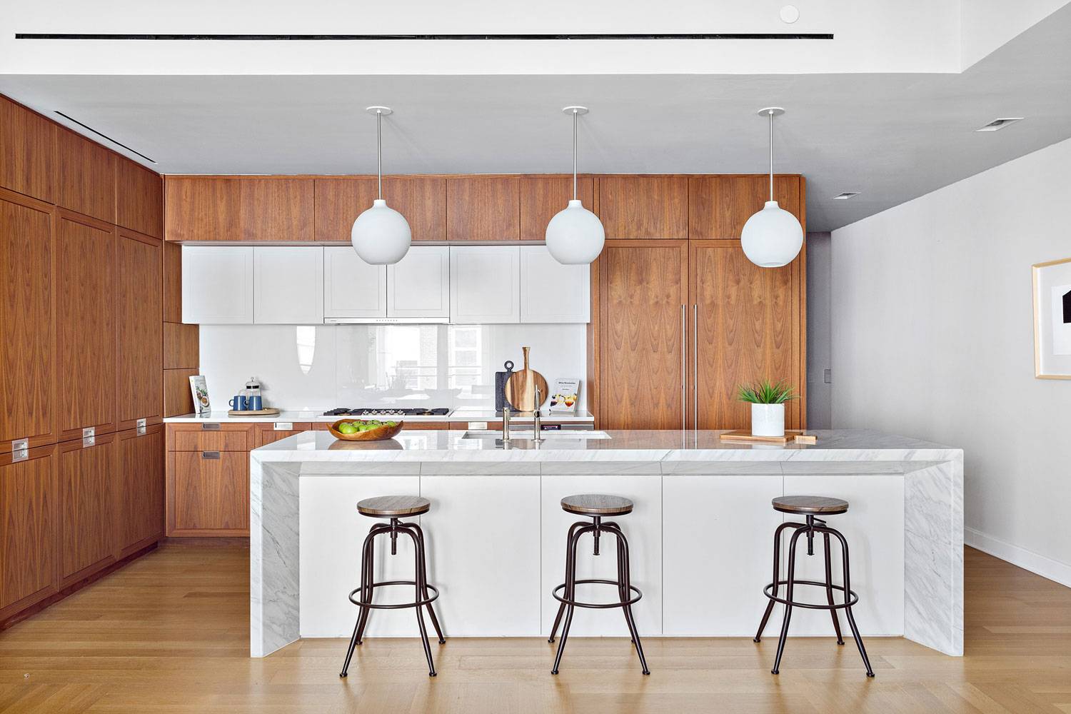 1289 Lexington spacious kitchen with wood cabinetry and island with seating